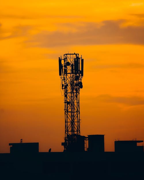 Silhouette of a Telecommunication Tower during Sunset