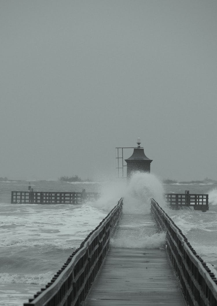 Wave Crushing On Wooden Pier