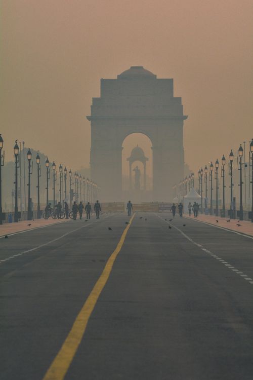 Free Silhouette of India Gate in hazy mist, creating an iconic and mysterious ambiance. Stock Photo