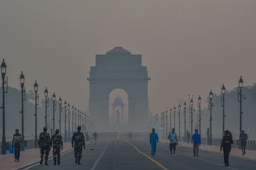 People Walking on a Road at Dawn 