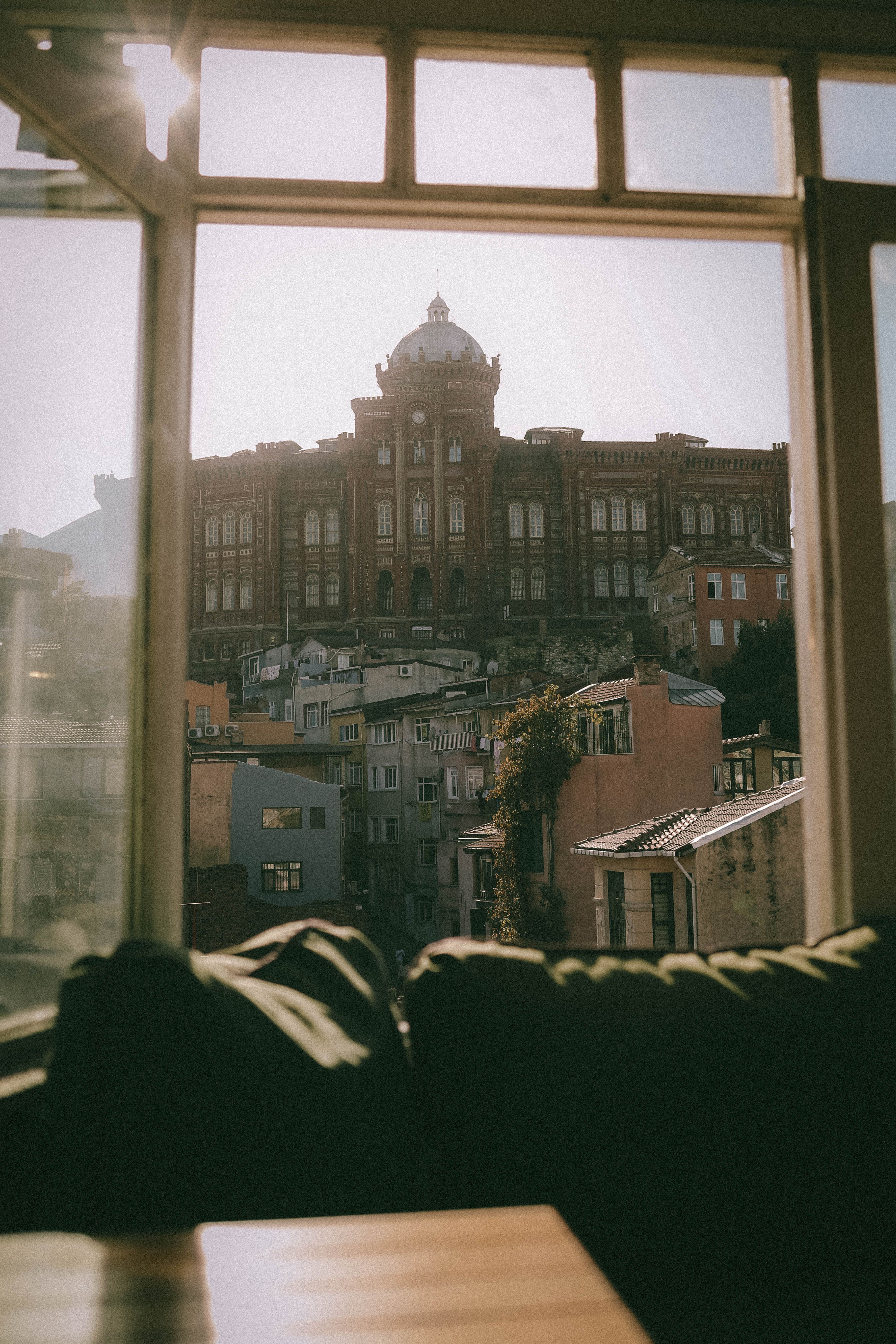 A captivating view of Phanar Greek Orthodox College seen through a cafe window in Istanbul, Turkey.