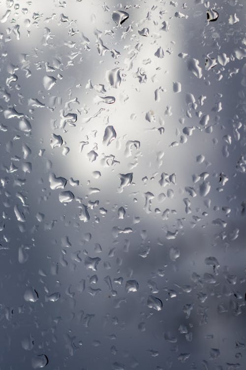 Free Water Droplets on Glass Panel Stock Photo