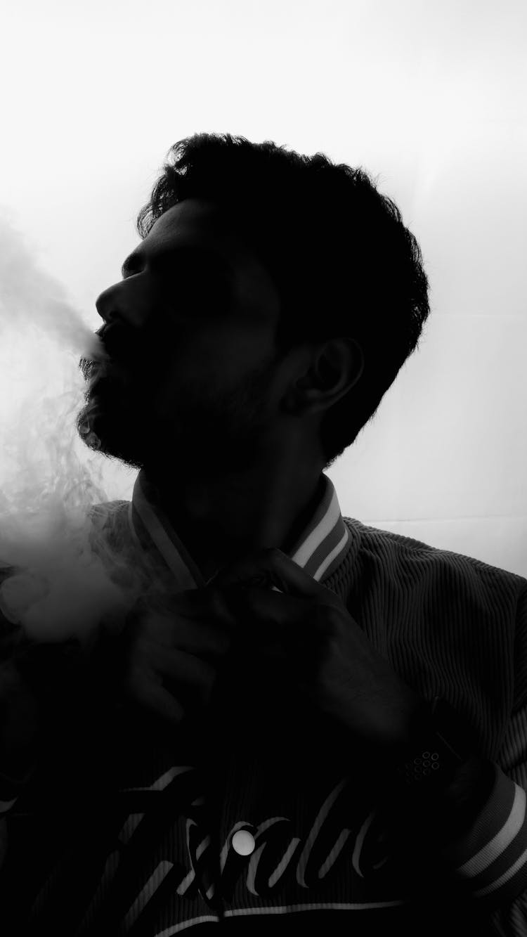 Smoking Man Head Silhouette In Black And White