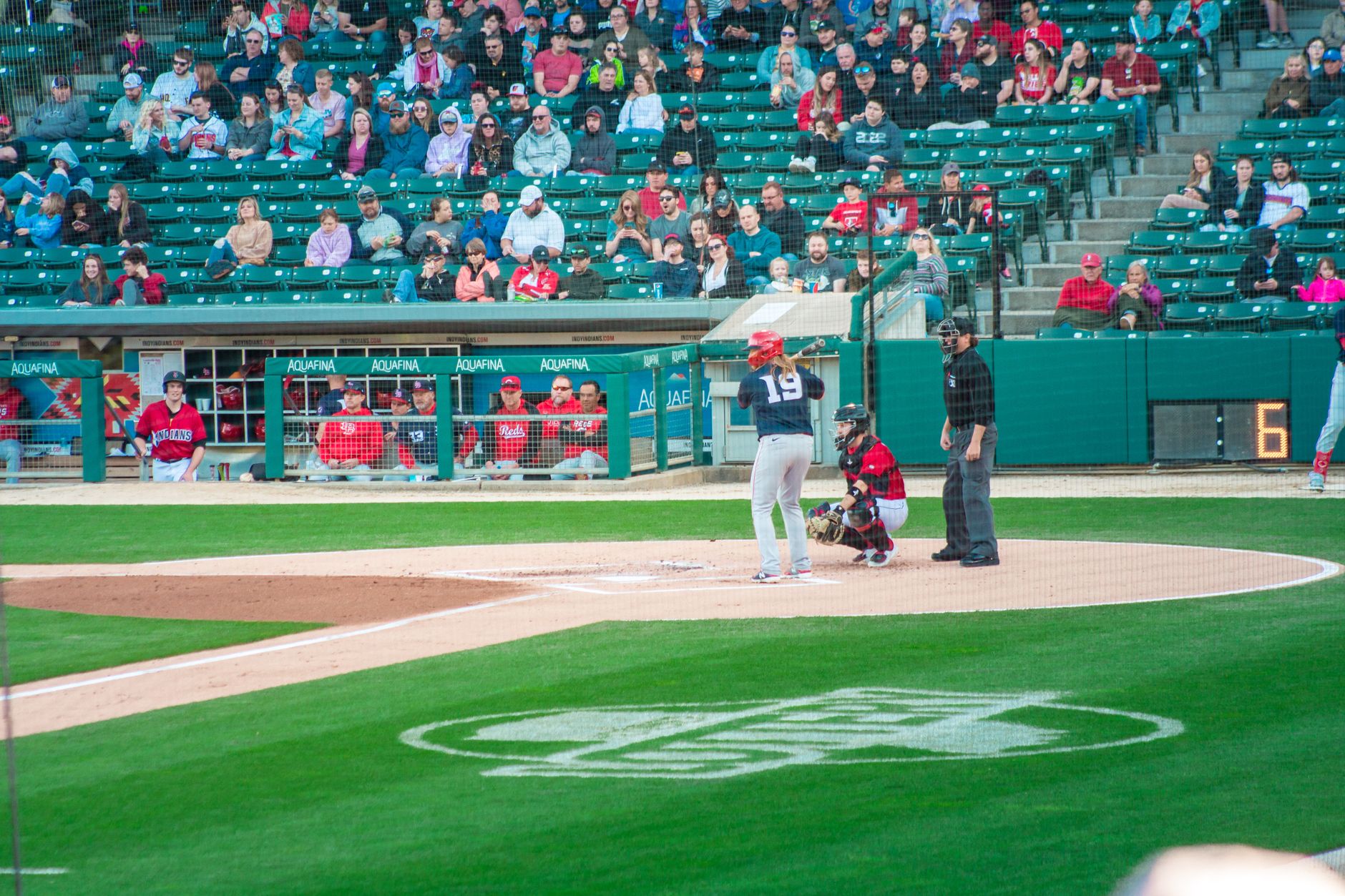 A thrilling baseball game at Victory Field, Indianapolis with players and crowd engaged.