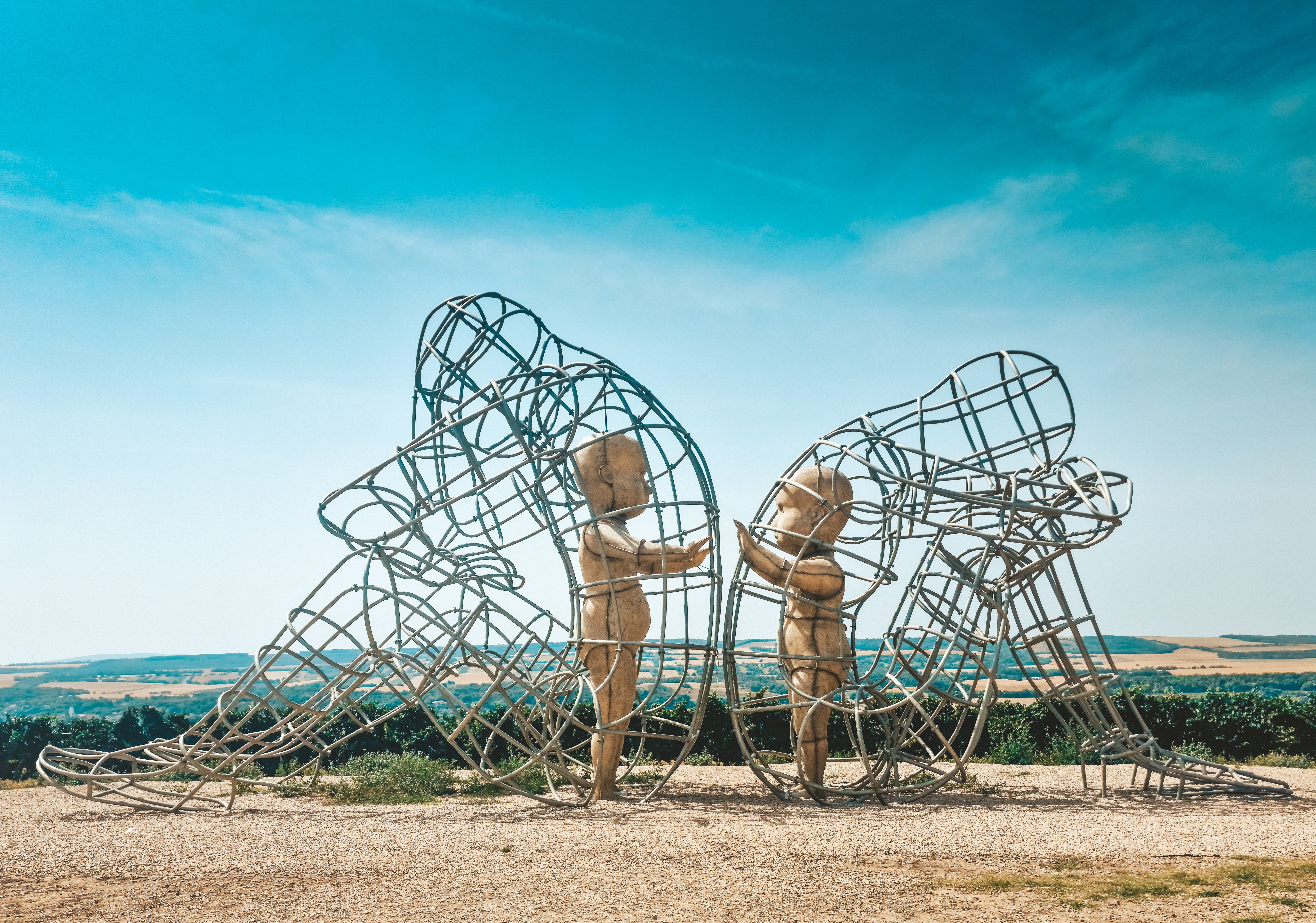 Brown Concrete Statues Under Blue Sky · Free Stock Photo