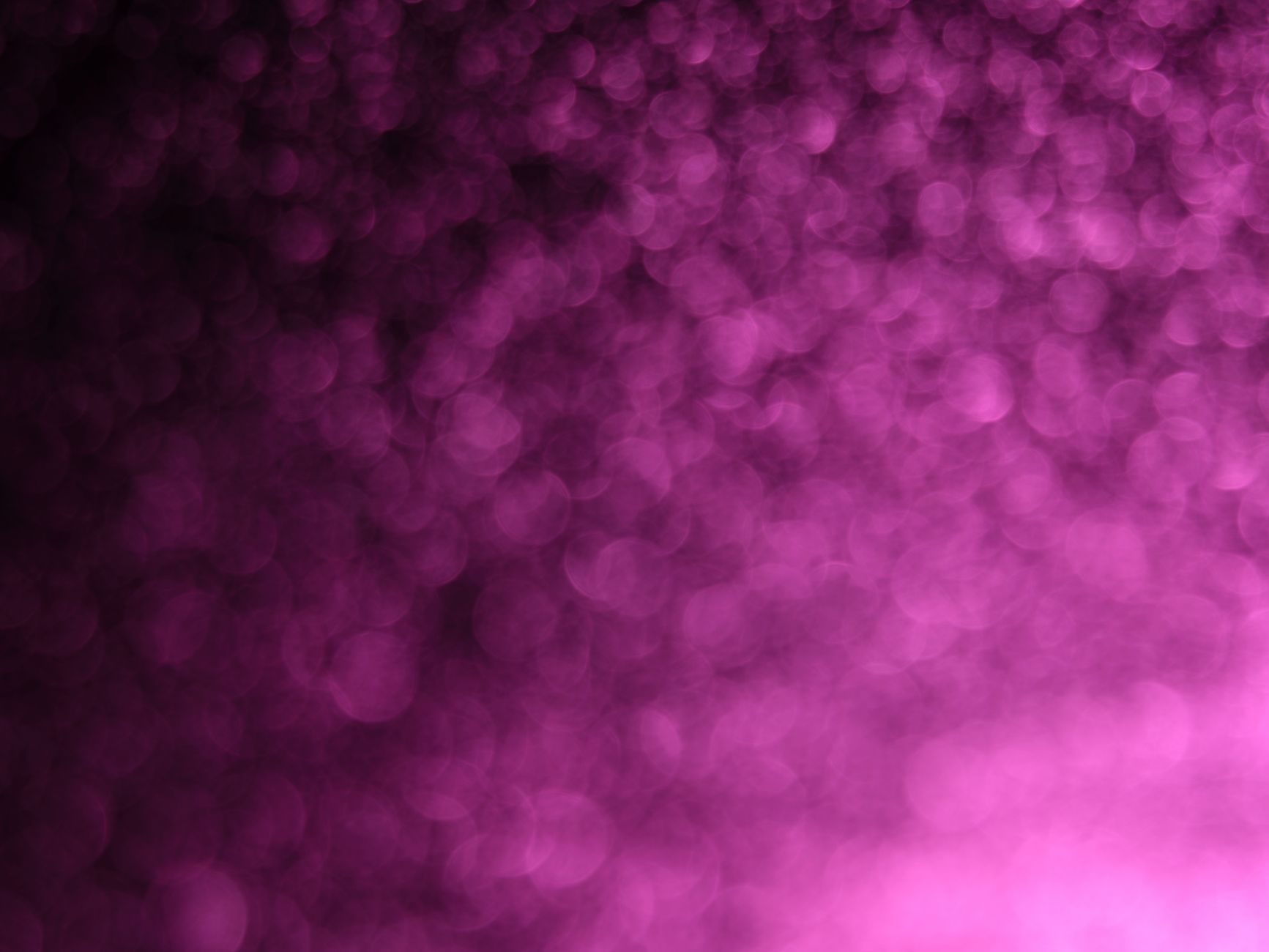 A captivating abstract background with purple bokeh lighting and a shimmering effect.
