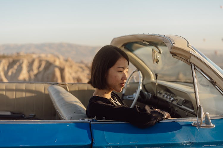 Woman Sitting In Car