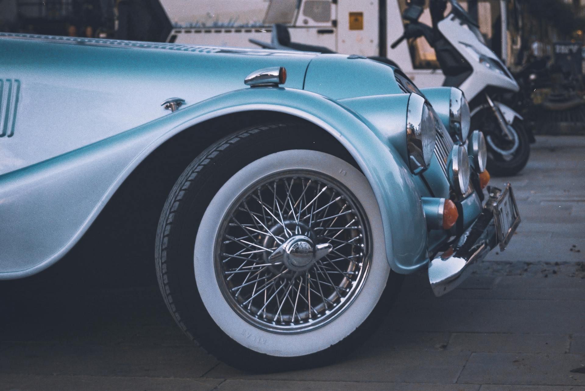 A detailed shot highlighting the classic design of a vintage Morgan Plus 4 car fender.