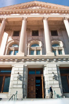 A low angle view of the grand facade of the Indiana State House in Indianapolis.