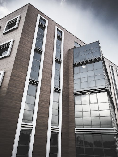 Brown and White Concrete Building with Glass Windows