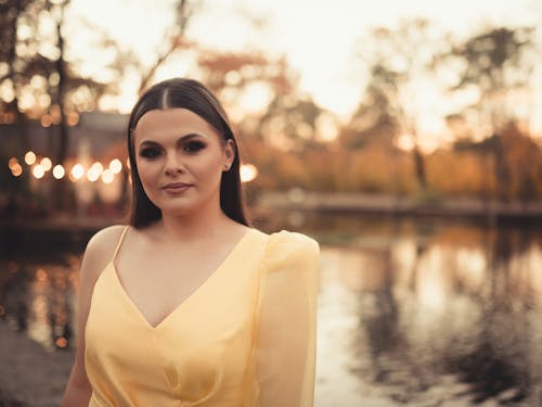 Woman in a Yellow Dress by a Pond