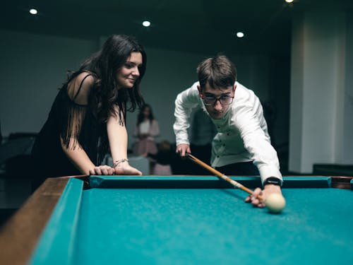 Two People Playing Pool 