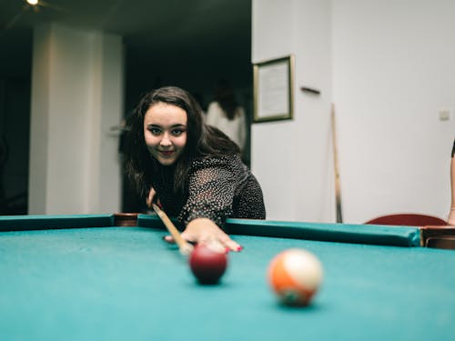 Photo of a Girl Playing Pool 