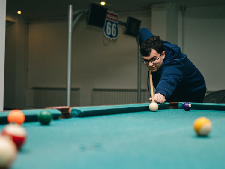 Man Playing Billiard