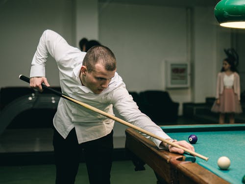 Man Holding a Cue 