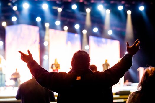 Man in Black Long Sleeve Shirt Raising His Hands