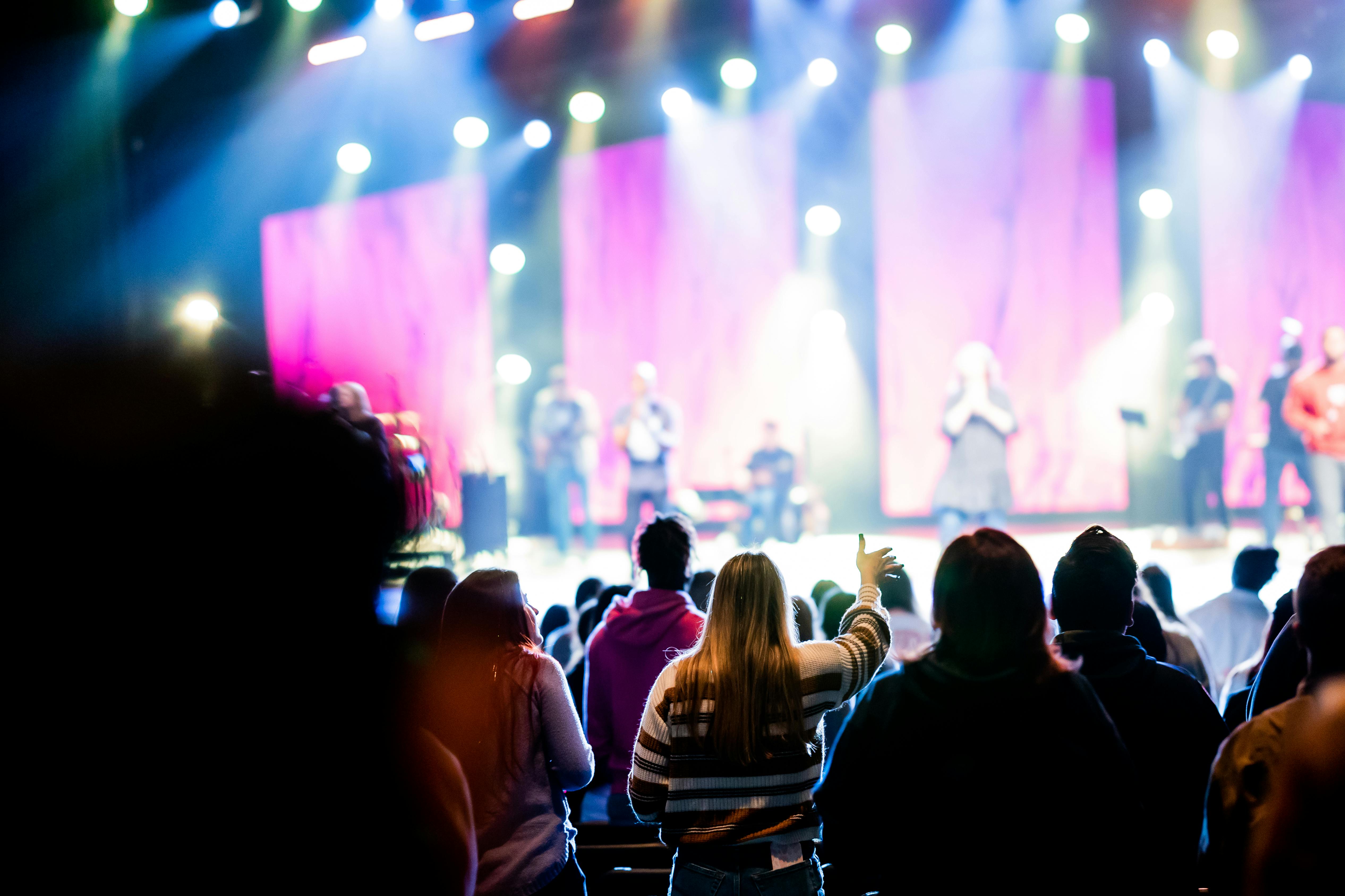 people watching a performance on stage