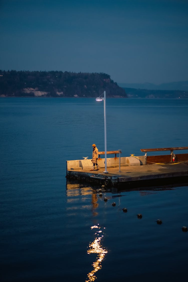 Woman Standing On Pier 