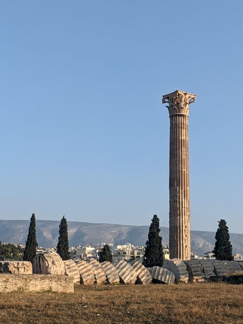 Free Explore the ancient Greek ruins featuring a lone standing column under a clear blue sky, perfect for history and travel enthusiasts. Stock Photo
