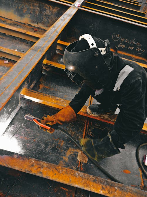 A Person Doing Welding 