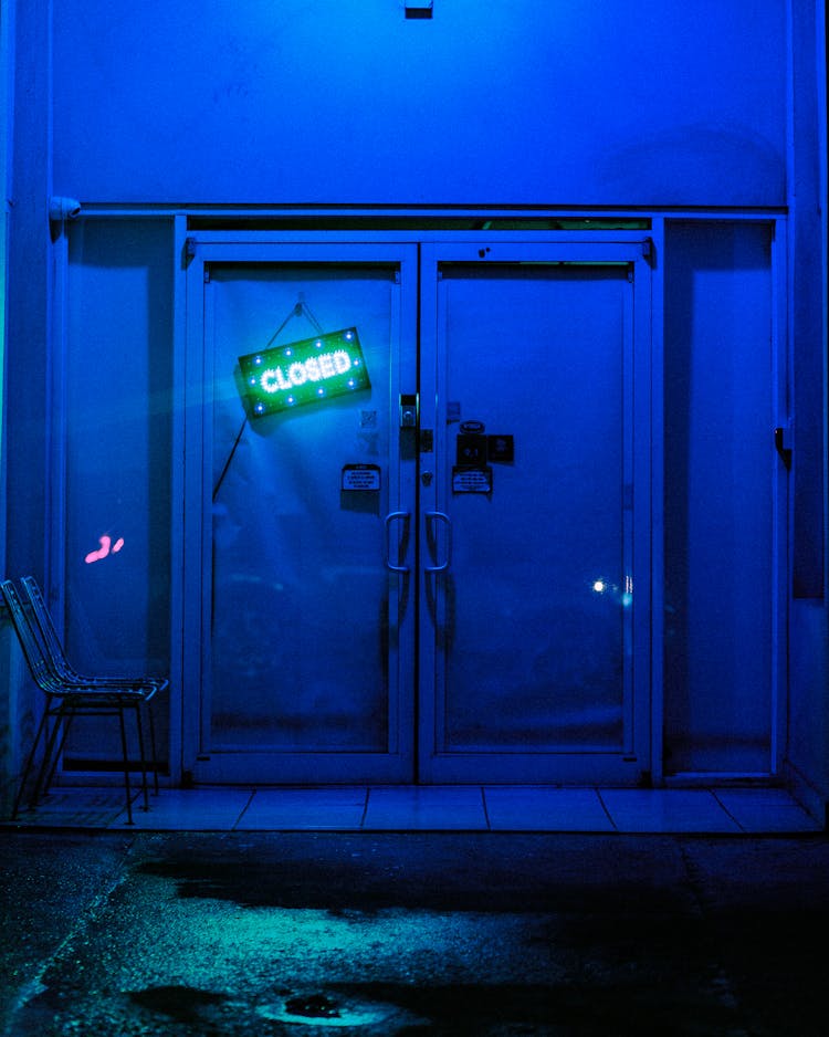 Closed Signage On Blue Metal Exterior Gate