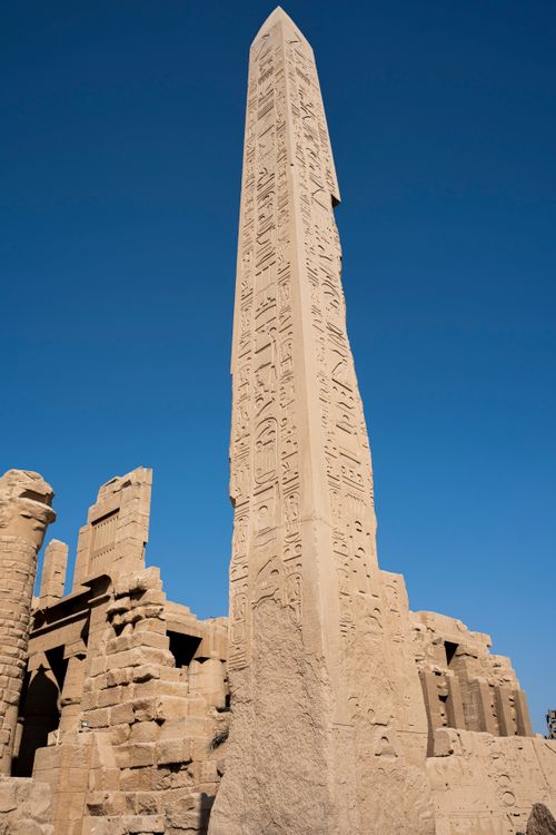 Free A towering ancient obelisk with hieroglyphics at the Karnak Temple in Egypt. Stock Photo