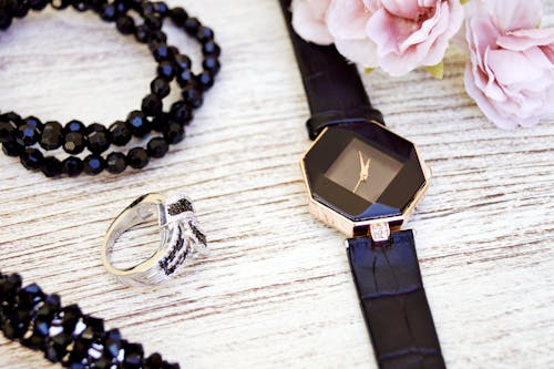 Black and Gold-colored Analog Watch With Leather Strap