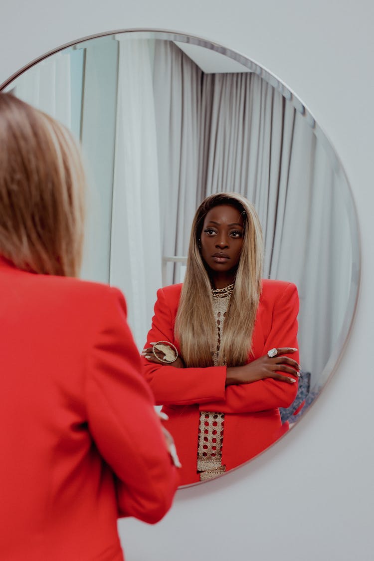 Beautiful Woman In Suit Looking In Mirror