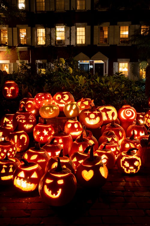 Illuminated Halloween Pumpkins at Night