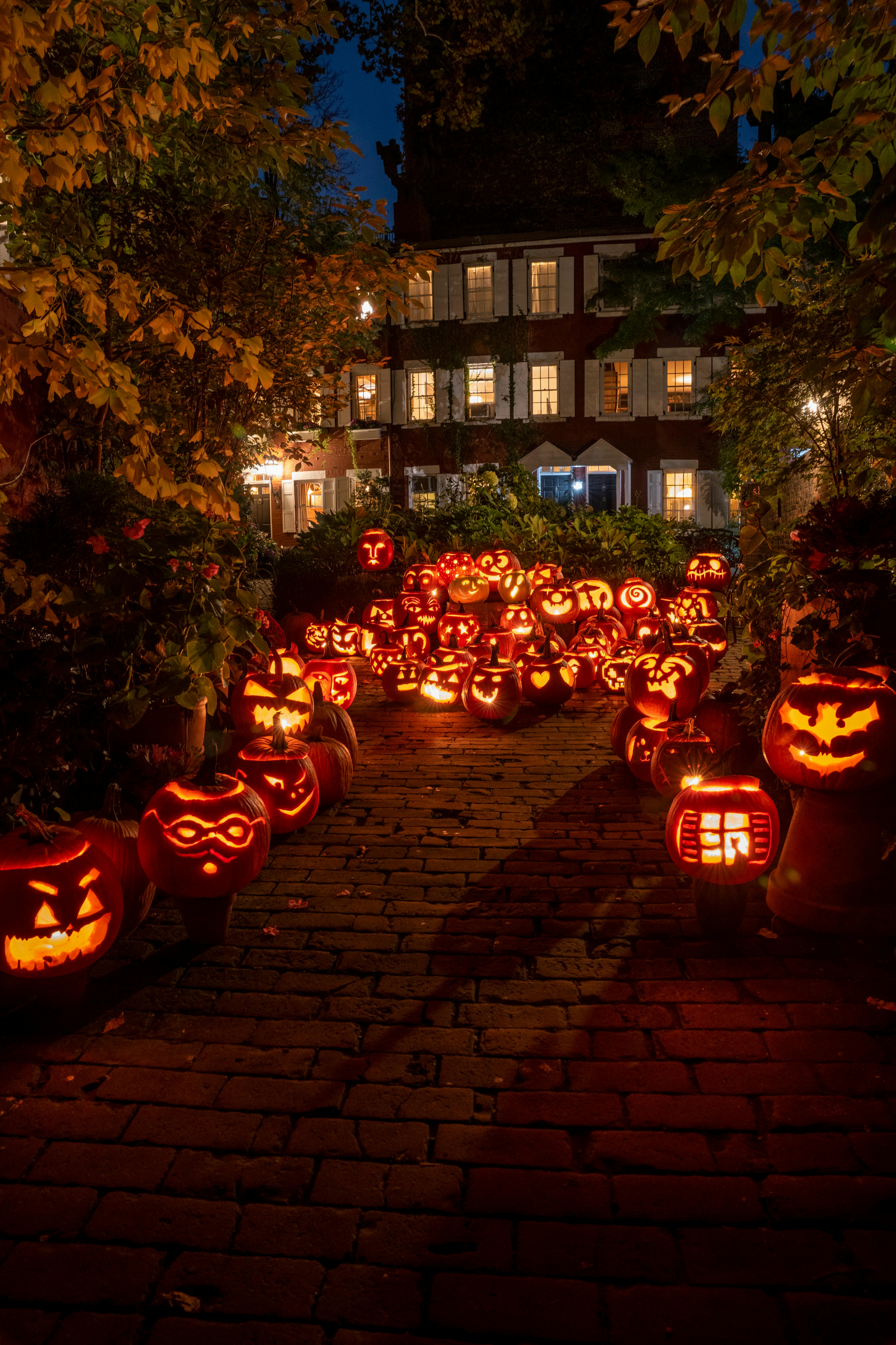 lighted jack o lanterns on street during night time