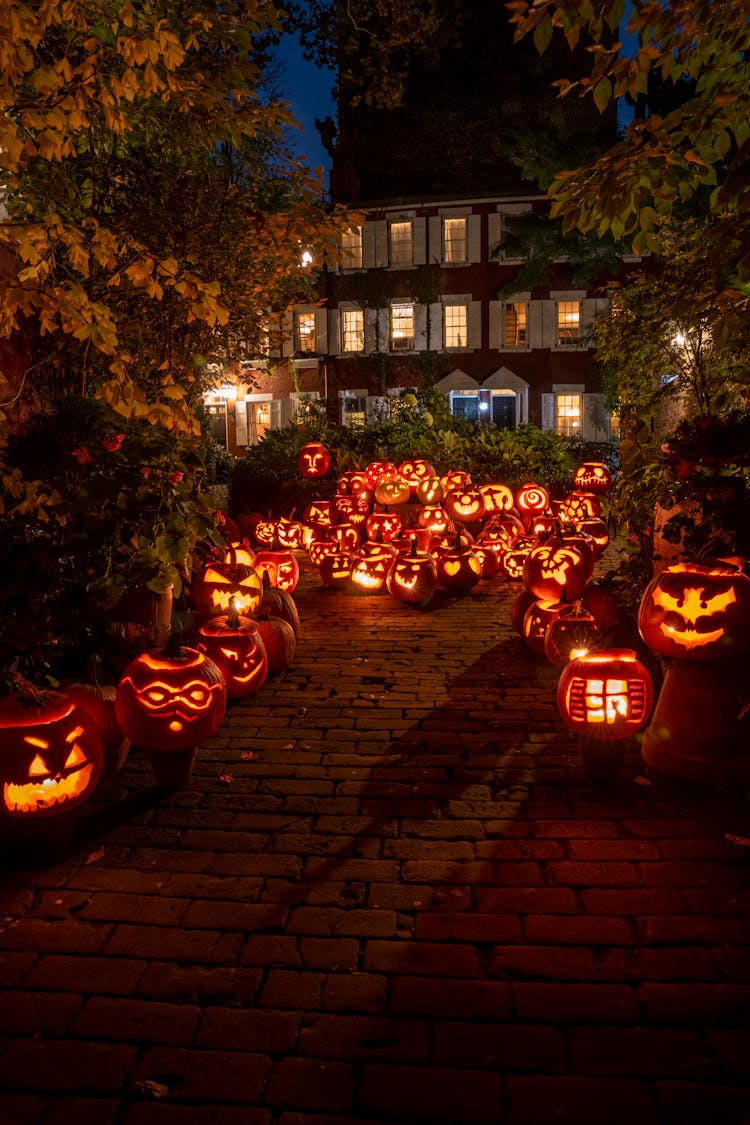 Lighted Jack O Lanterns On Street During Night Time