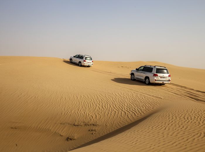 Four-wheel-drive vehicle on desert dunes, by Elena Zhuravleva on Pexels