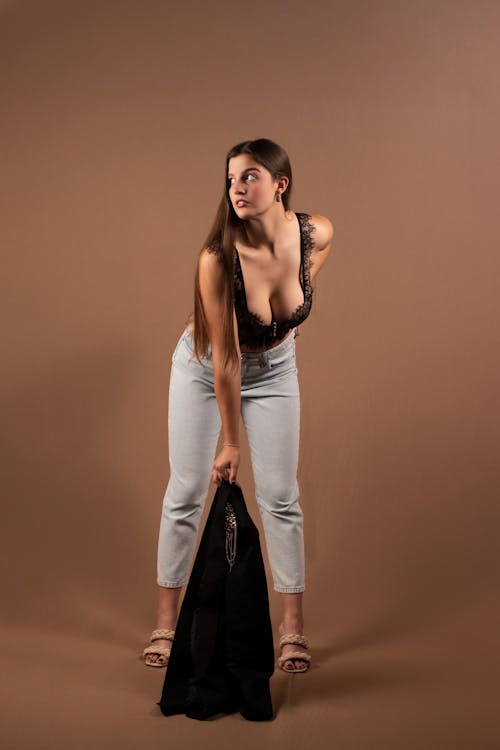 Model Standing on Brown Background