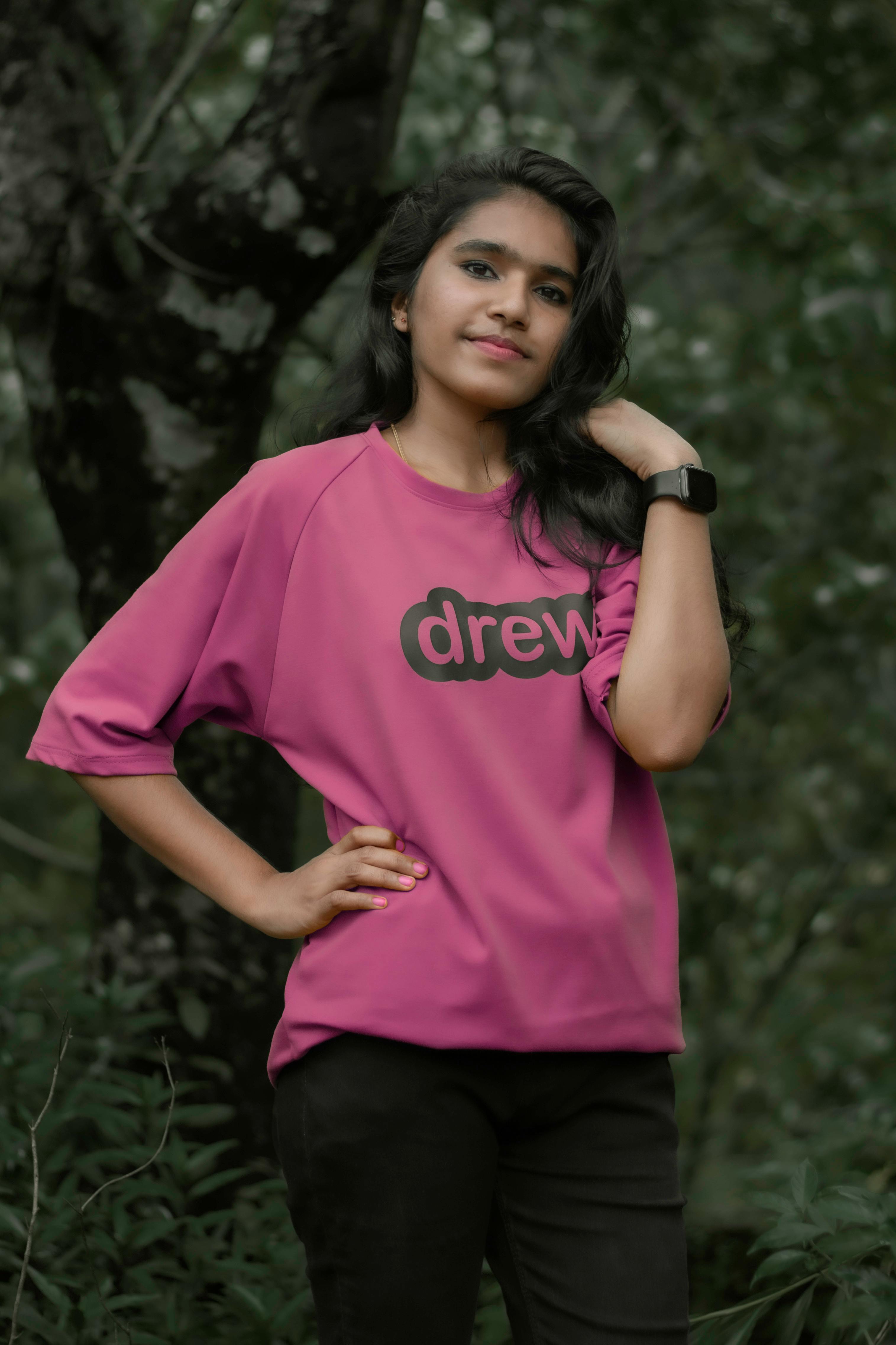 Teenager Girl in Hot Pink Shirt Sitting on Street · Free Stock Photo