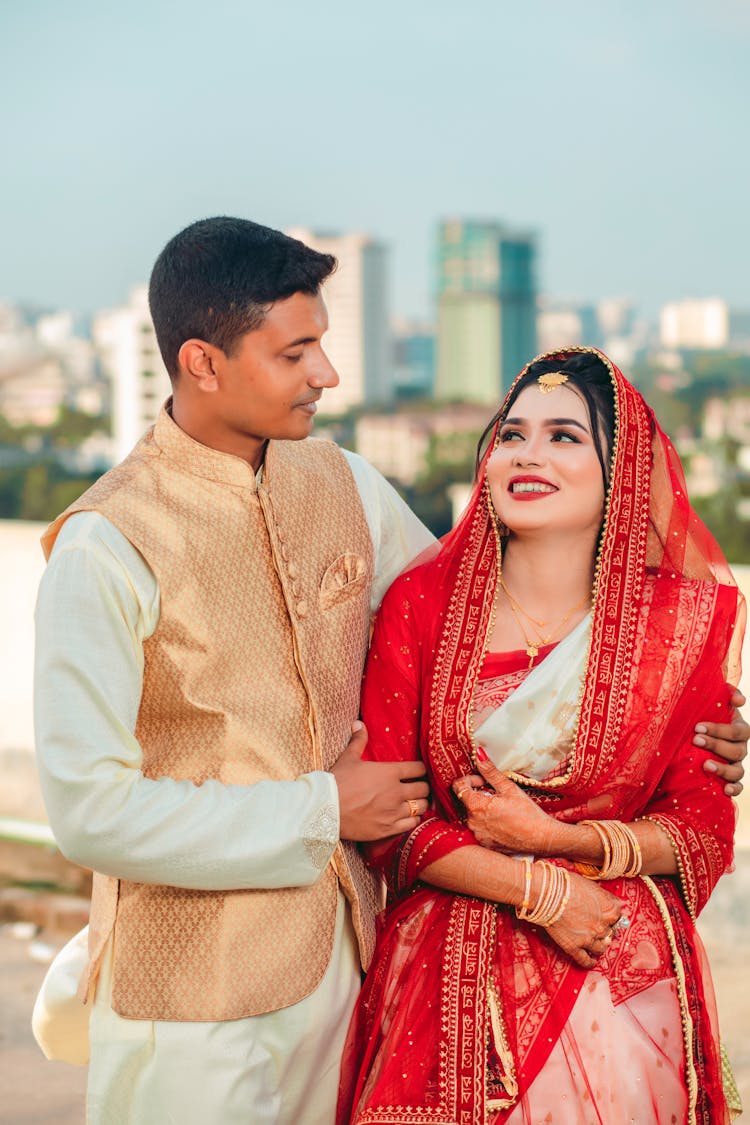 A Couple In Traditional Bangladeshi Wedding Gowns 