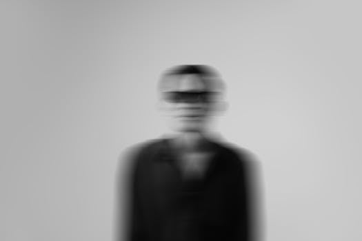 Artistic black and white portrait with blurred motion, perfect for conceptual themes.
