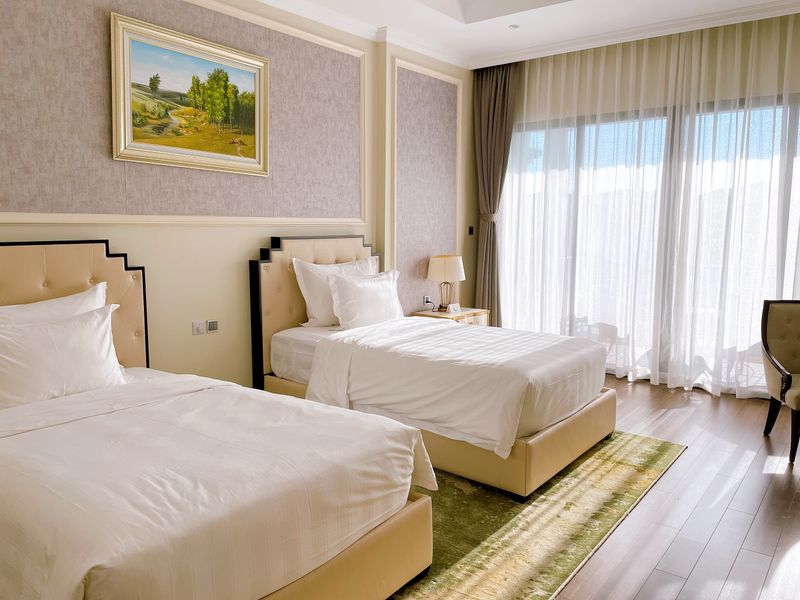 Stylish modern bedroom interior with luxury bedding