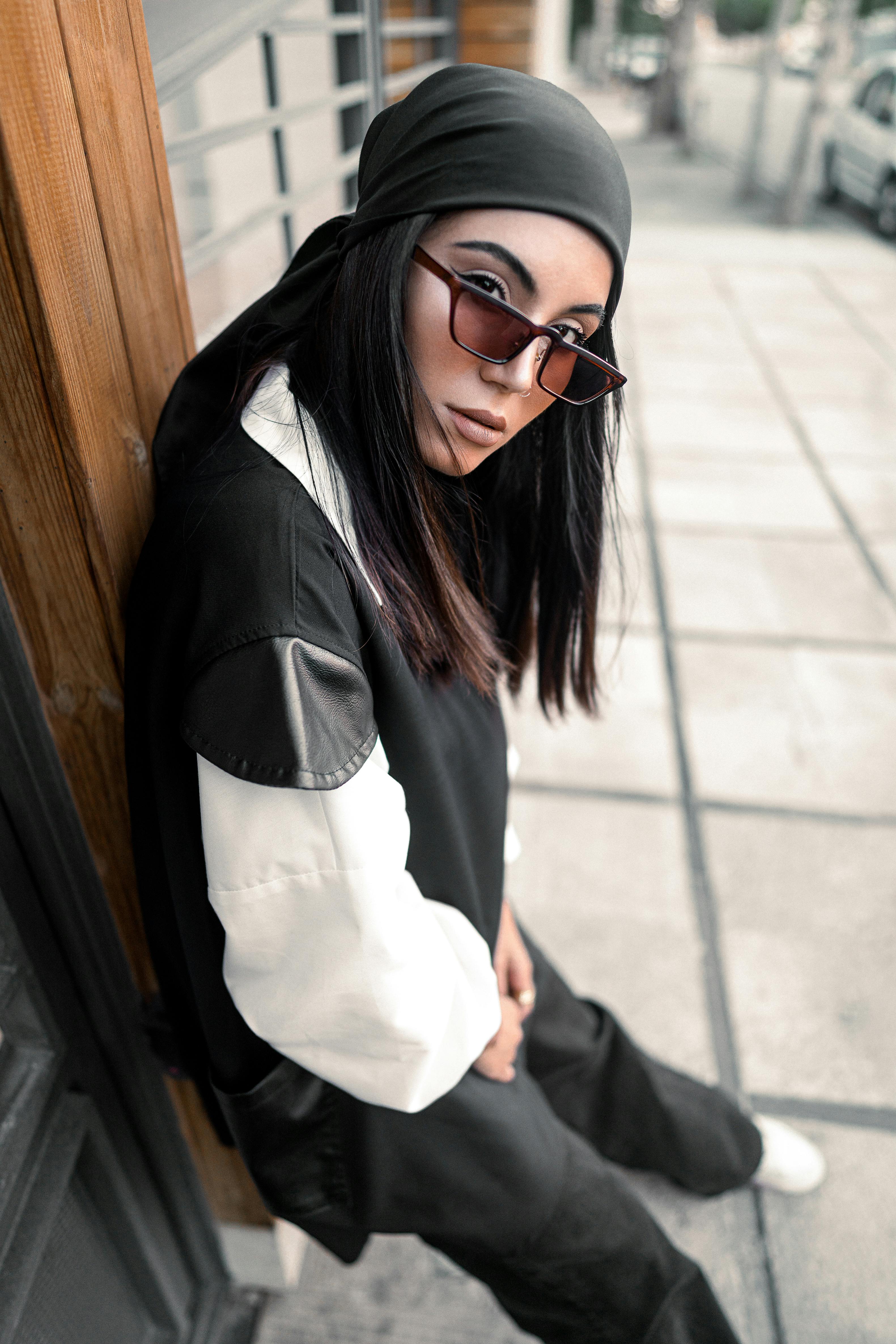 Stylish Girl in Sunglasses and Beanie Posing on Street · Free Stock Photo