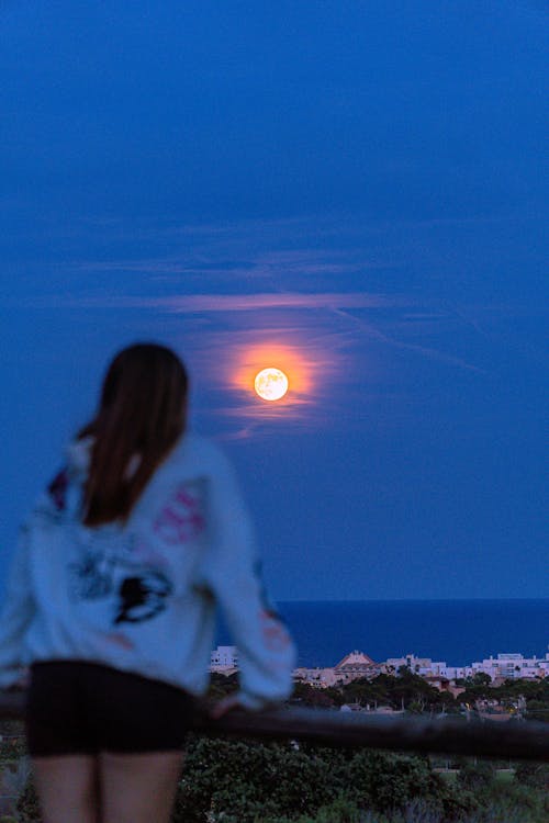 A Woman Looking a the Moon