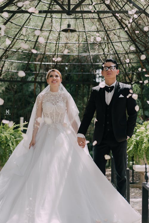 Bride and Bridegroom Looking at Falling Petals