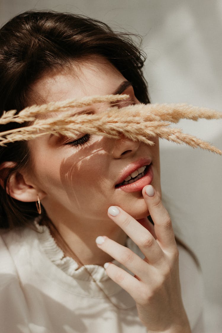 Hay Over Woman Face With Eyes Closed