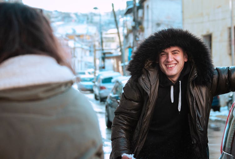 A Man Wearing Parka Jacket Laughing