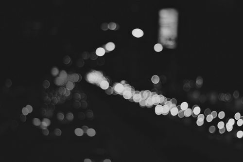 Free A black and white abstract image featuring bokeh of city lights at night in Jakarta. Stock Photo