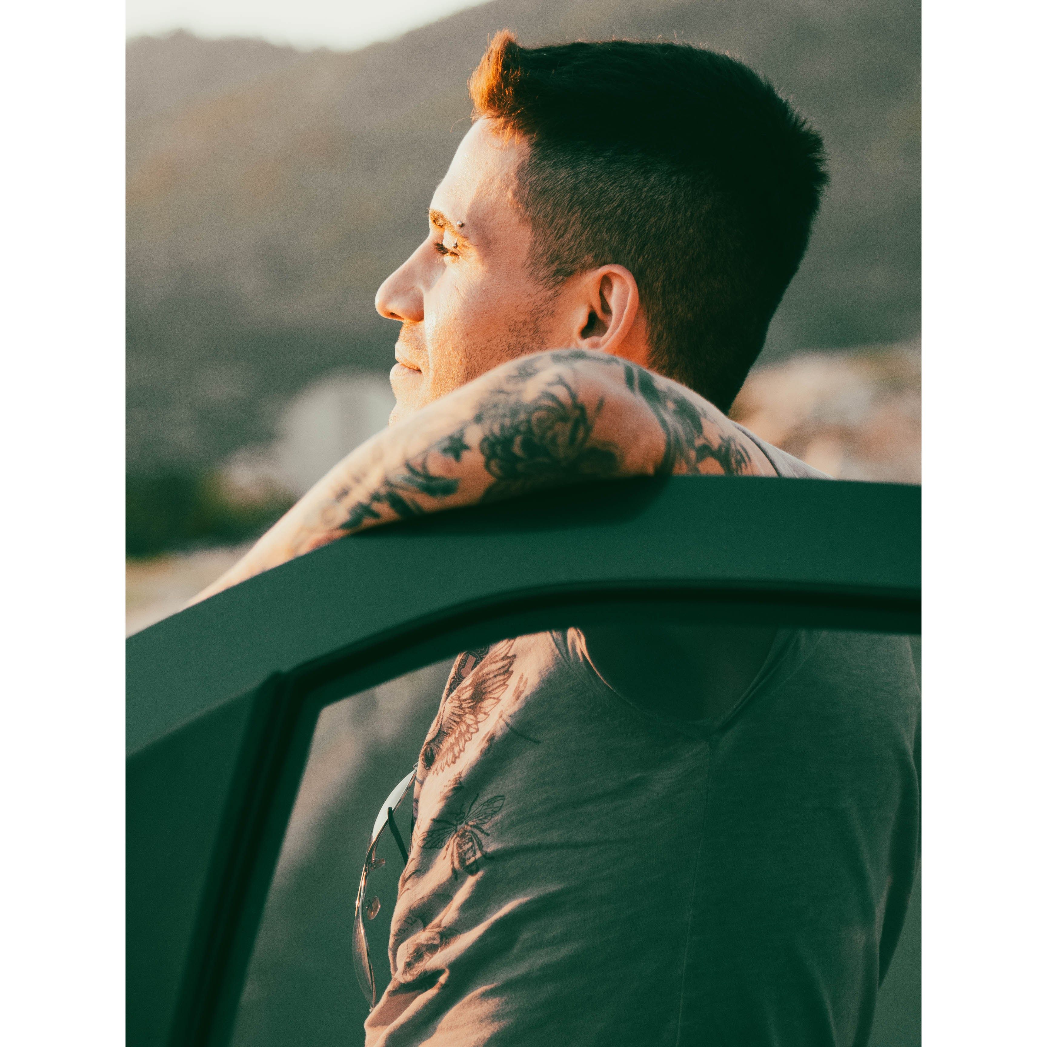 A Man Leaning on the Car Door