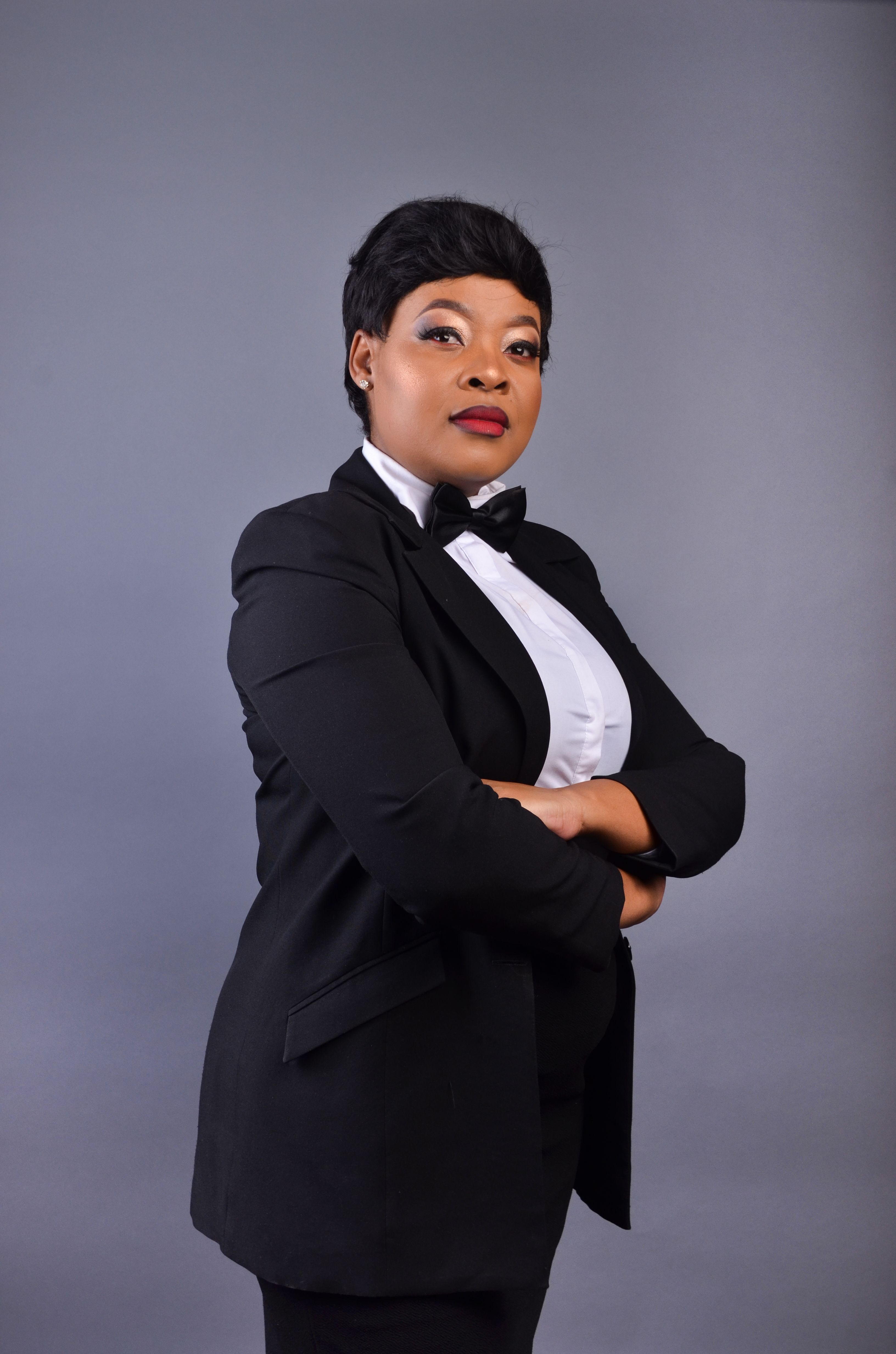 Portrait of a Woman in a Blazer Posing with Her Arms Crossed · Free ...