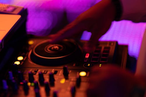 DJ mixing live music at a dance club
