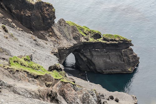 Gray Promontory Near Body of Water