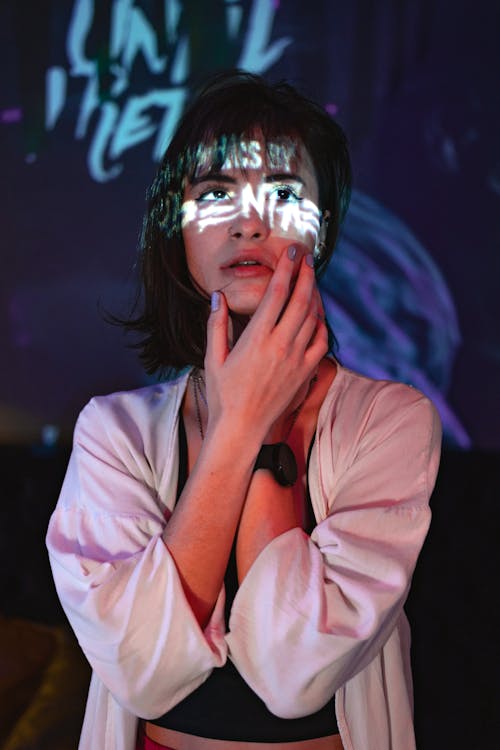 A Woman with Projector Light on her Face