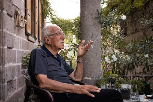 Elderly Man Smoking Cigarette