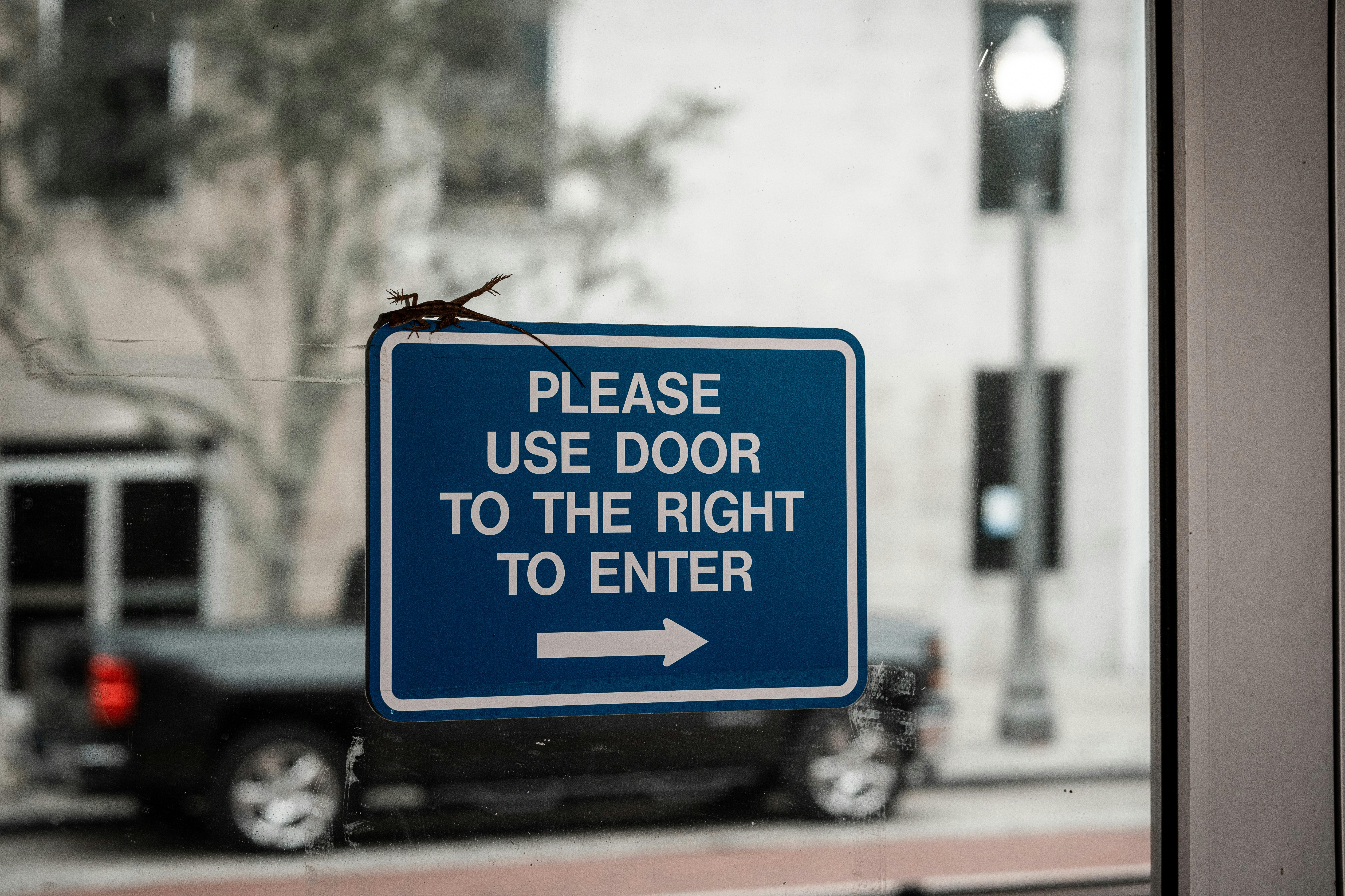 Sign on Glass Door · Free Stock Photo